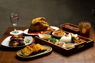 Delicious Indonesian cuisine displayed elegantly on a wooden table, perfect for food and culture enthusiasts.