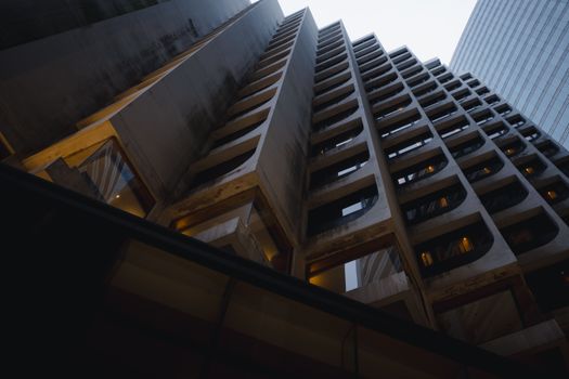 A striking view of modern urban architecture, showcasing geometric patterns and a dynamic angle.