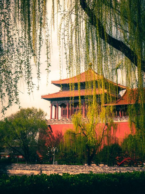 Free Scenic view of a traditional Chinese building surrounded by lush trees in Beijing, China. Stock Photo