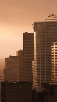 City skyscrapers basking in the warm glow of a sunset, defining urban landscape beauty.