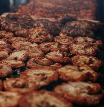 Delicious assortment of grilled meats sizzling on an open barbecue in Argentina.
