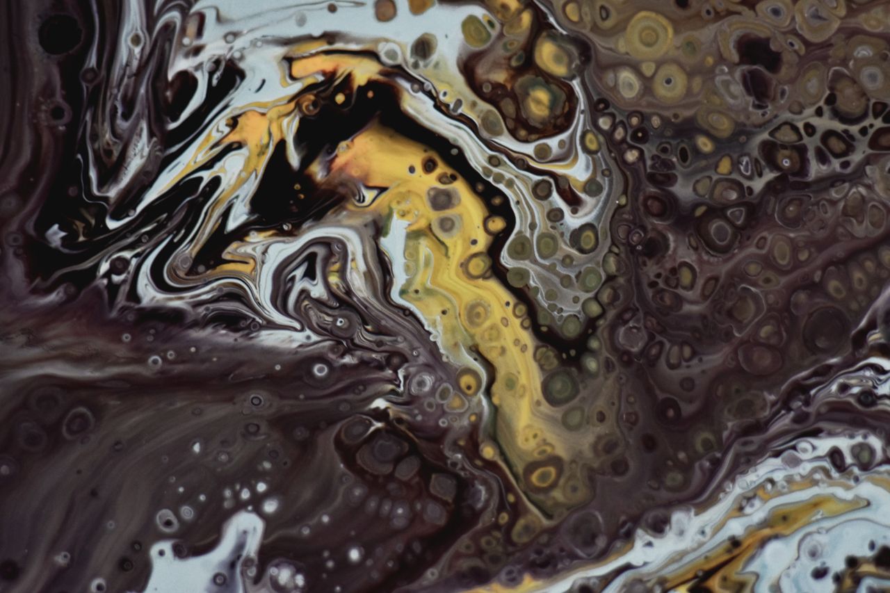 abstract artwork featuring vibrant swirling colors and complex texture