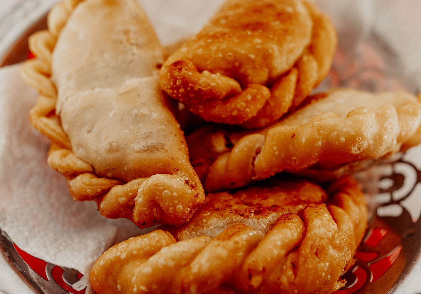 Delicious Argentine empanadas served on a plate. Perfect representation of authentic Provincia de Buenos Aires cuisine.