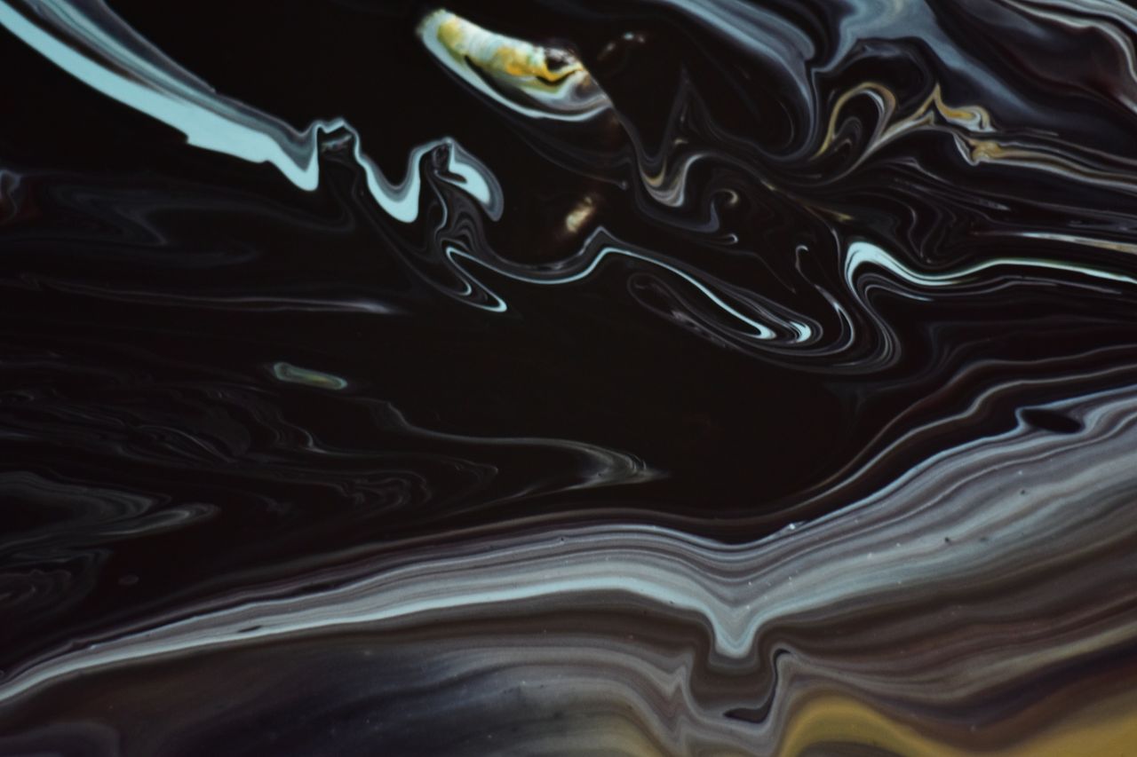 explore the fluid dynamics of dark toned abstract art with swirling pa