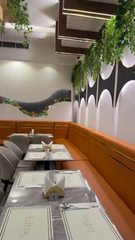 Stylish indoor restaurant featuring vibrant decor and modern furnishings.