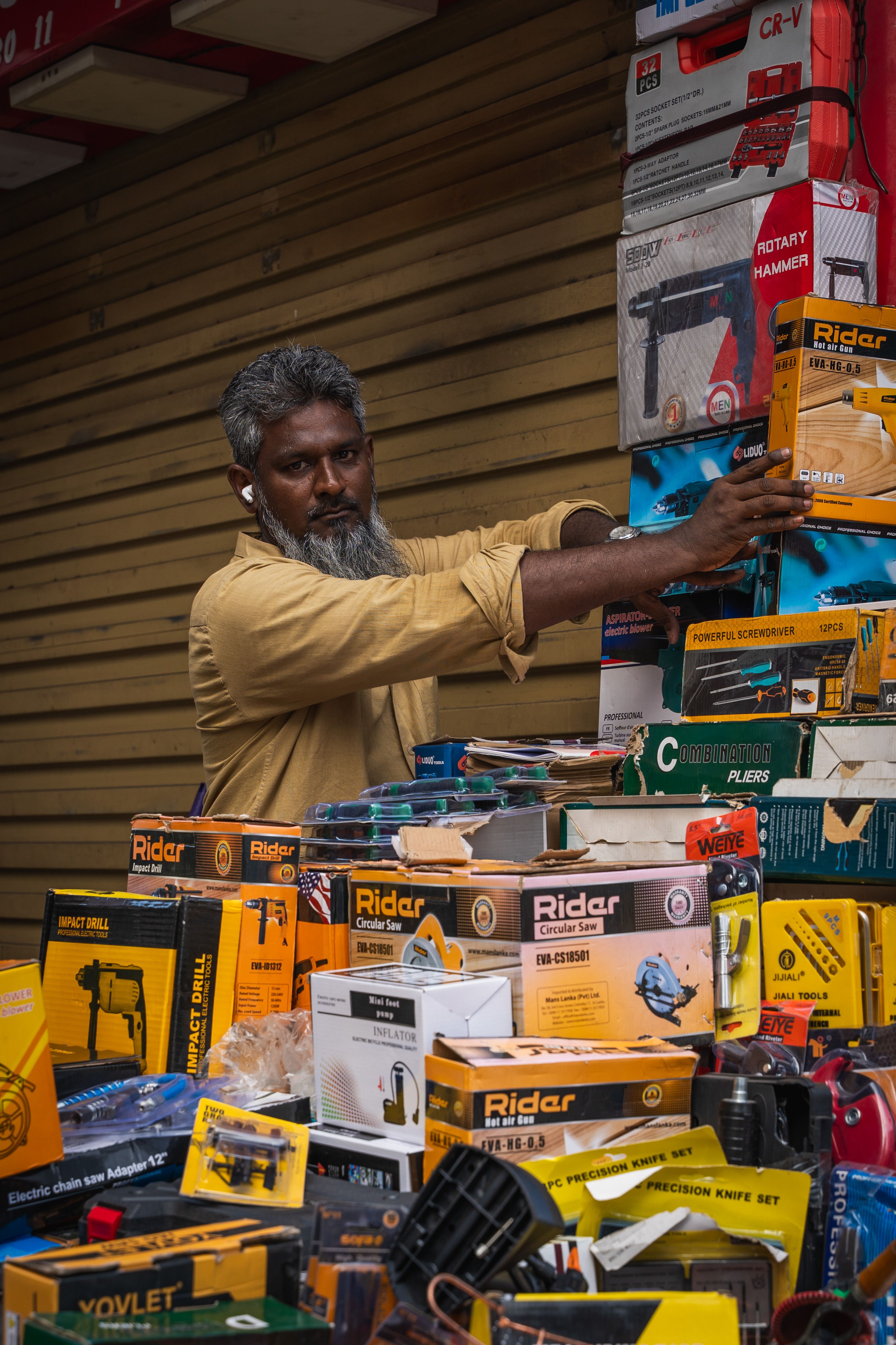 Inside a busy Sri Lankan hardware store stacked with supplies