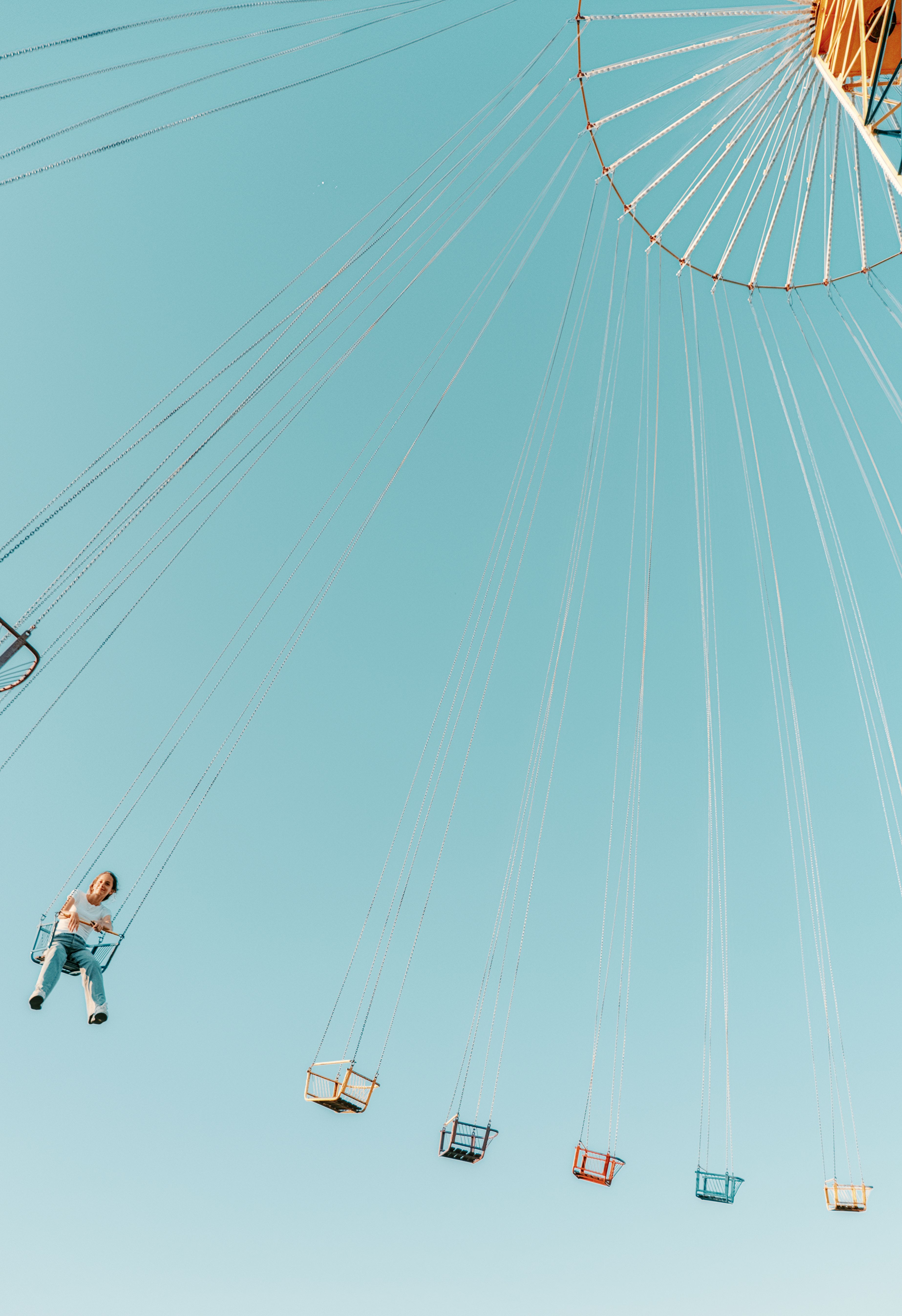 Colorful Carousel Ride Against Clear Blue Sky · Free Stock Photo