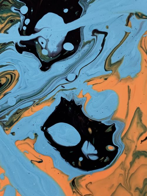 Free Dynamic abstract painting showcasing fluid art with swirling blue and orange hues. Stock Photo