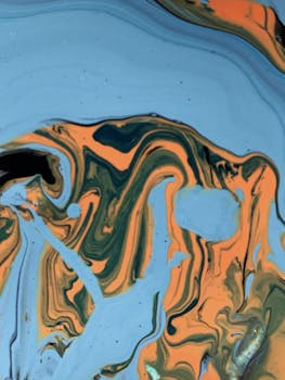 动态抽象流体艺术以旋转的蓝色和橙色图案，展现现代艺术表达方式