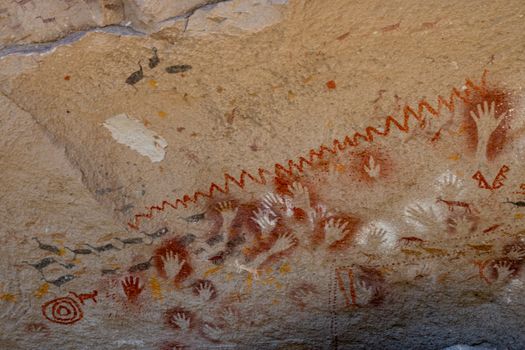 Historic cave art featuring stenciled hands at Cueva de las Manos in Santa Cruz, Argentina.