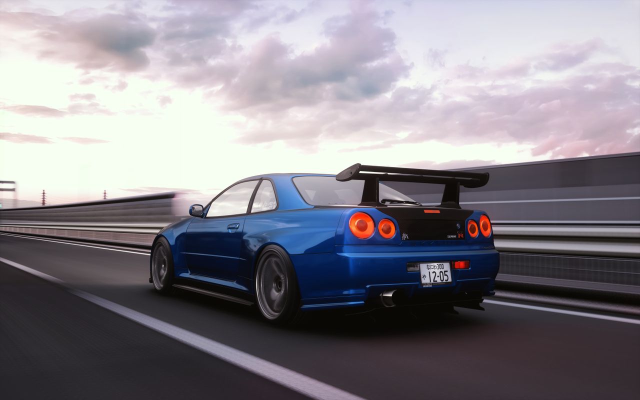 a blue sports car speeds on a highway in hokkaido japan during a vibra