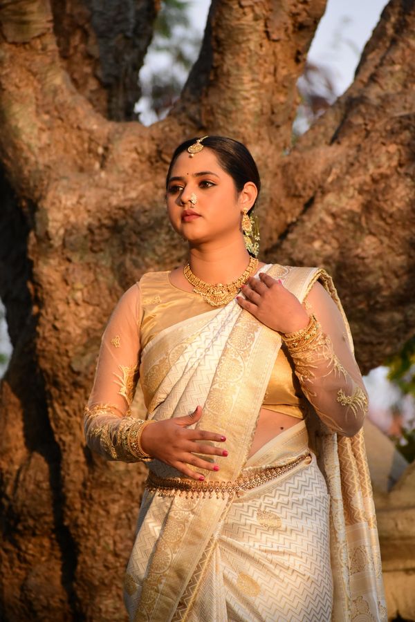 Full-length golden saree draping elegance by Royal Glow Beauty Makeover Hyderabad