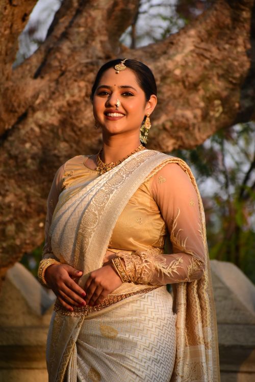 Free Portrait of an adult woman in a traditional Indian sari, captured outdoors during the day. Stock Photo