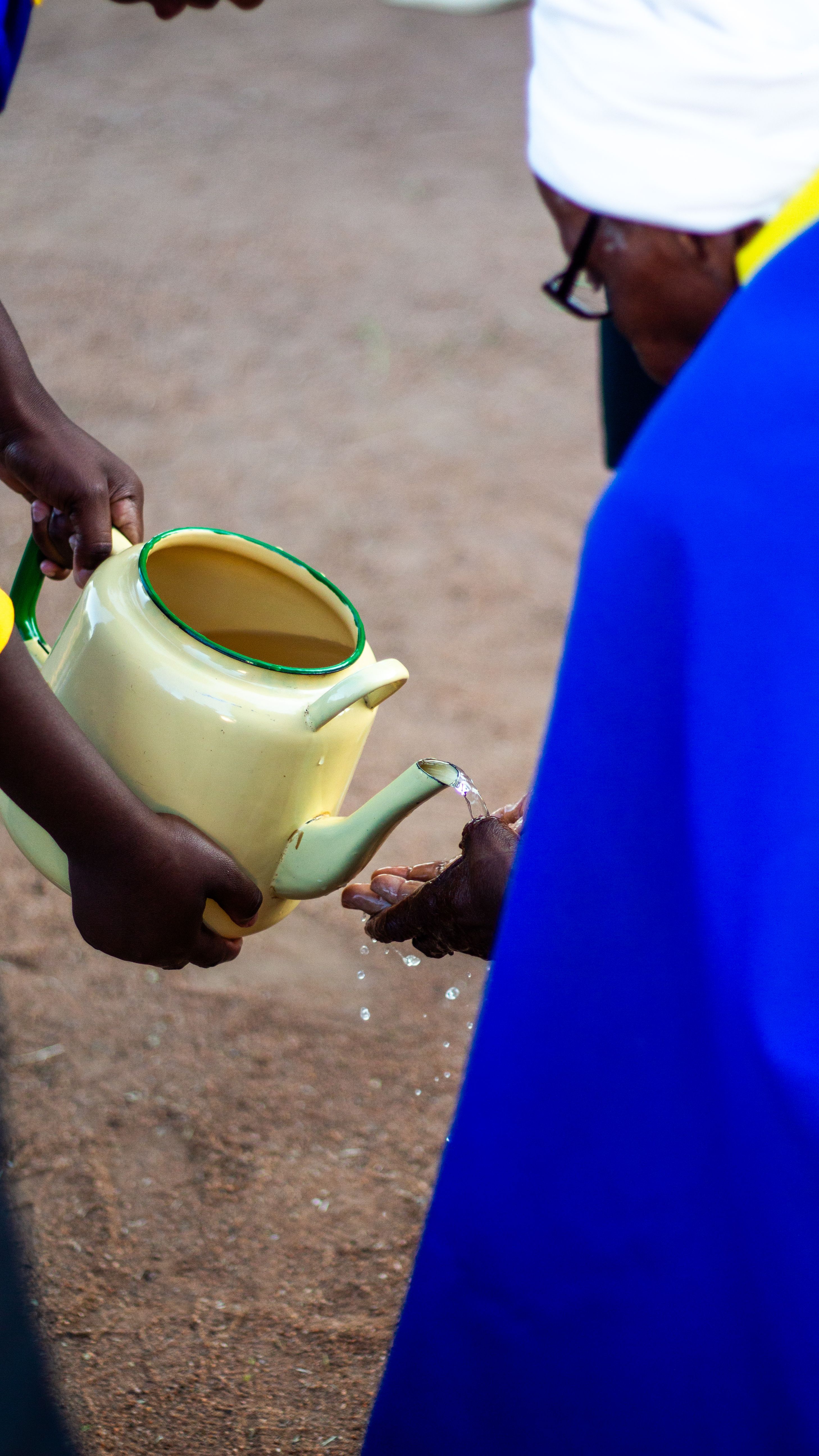 Cultural Handwashing Ritual with Water Jug · Free Stock Photo