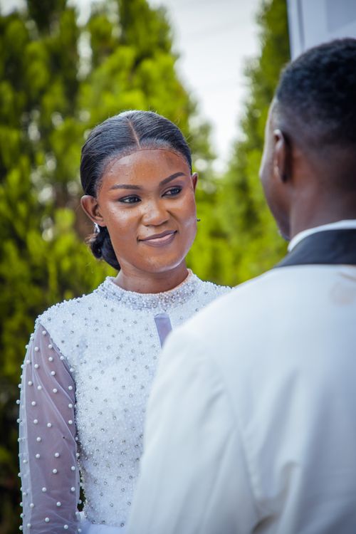 Free A heartfelt moment between a couple during an outdoor wedding ceremony. Stock Photo