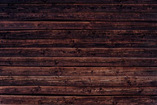 Free High-resolution image of dark wooden planks creating a rustic background. Stock Photo