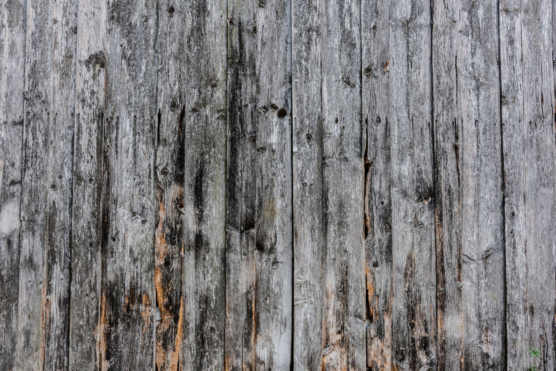 How to Choose the Best Flooring for Every Room 4 Close-up of rough and weathered wooden planks showcasing rustic texture and natural patterns.