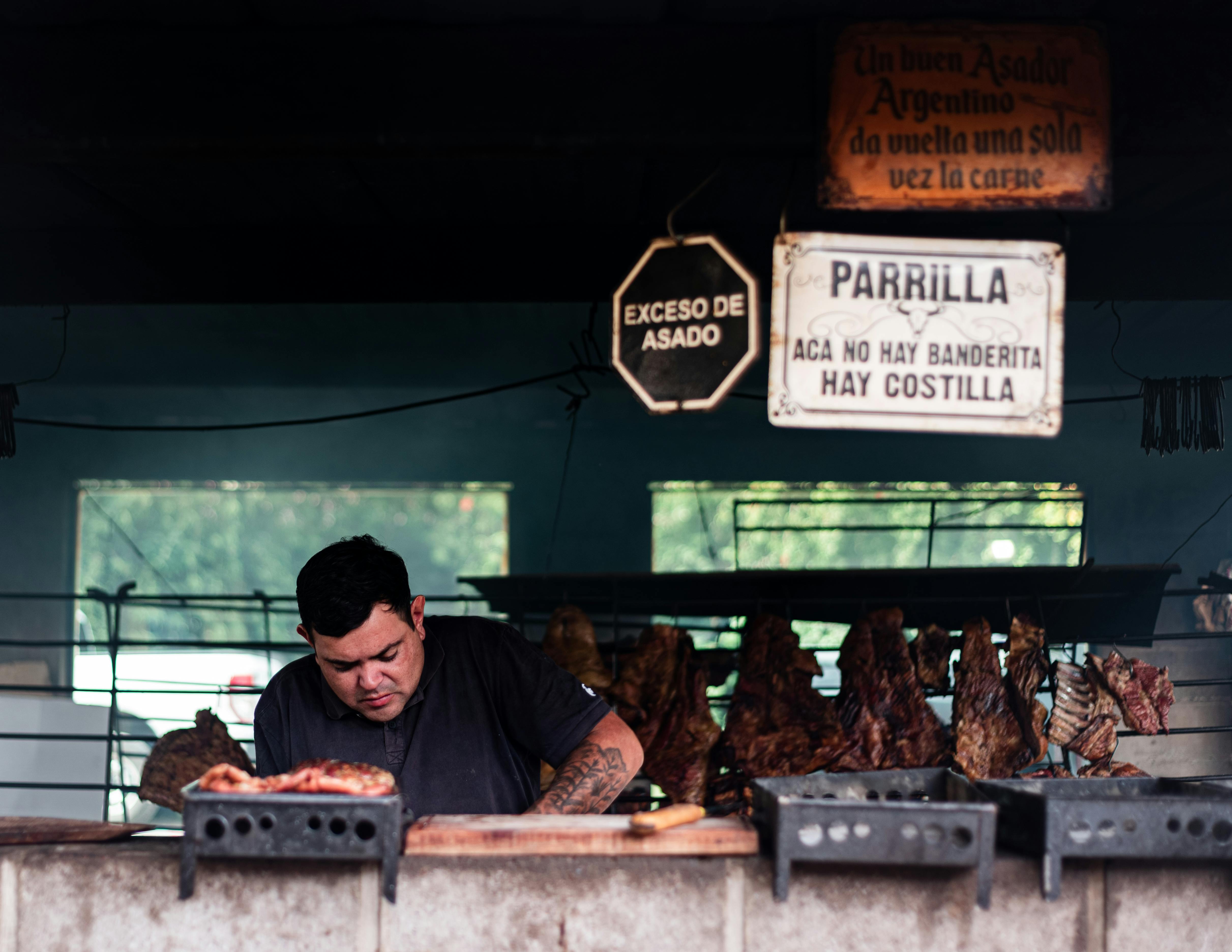 Experience the traditional Argentine asado at a parrilla in Uribelarrea, Buenos Aires, capturing the essence of local culture.