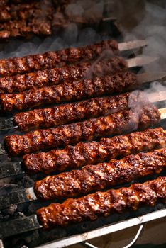 Close-up of sizzling grilled kebabs on a barbecue grill, exuding mouthwatering aroma.
