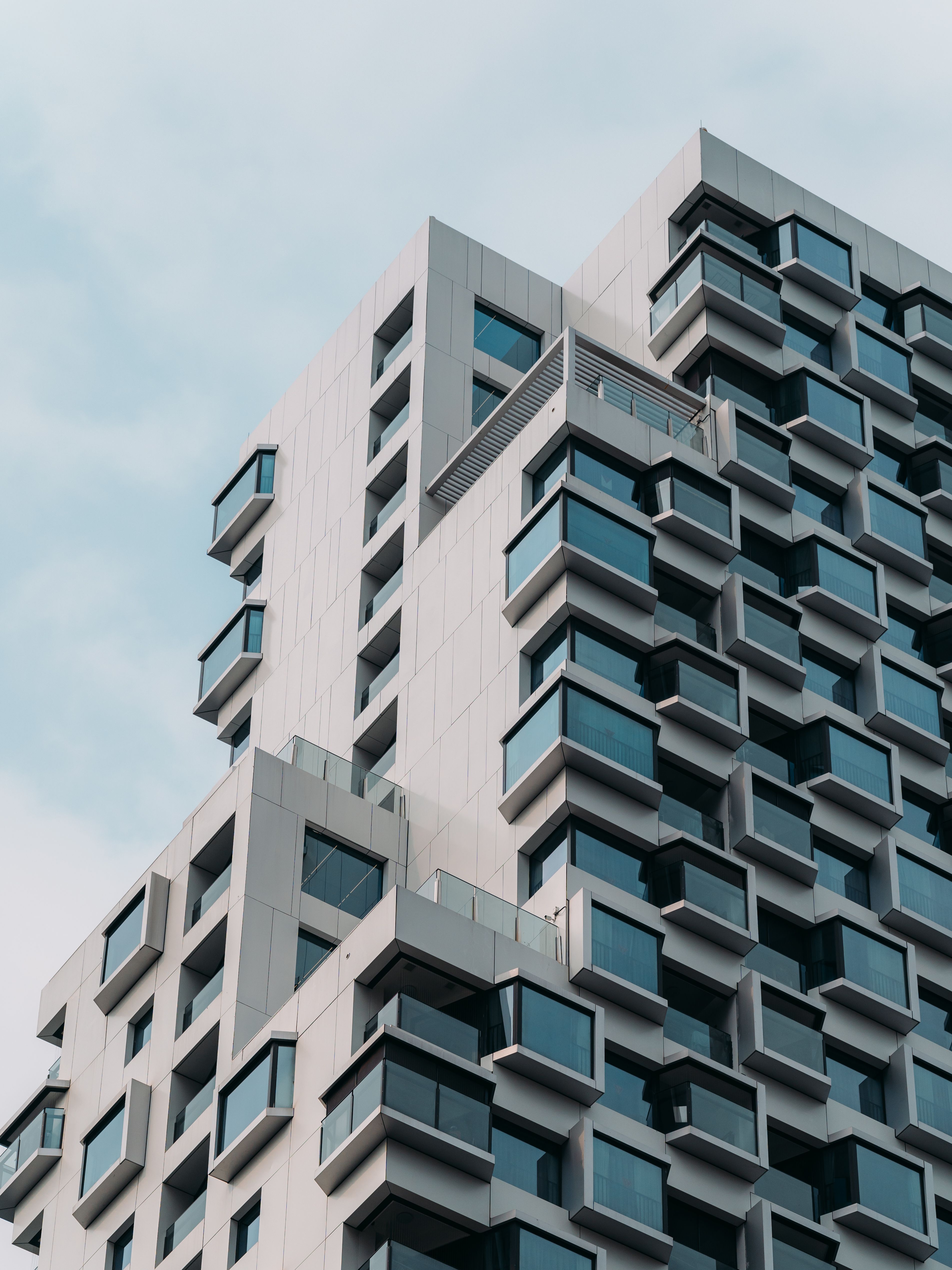Modern High-Rise Building with Unique Architecture · Free Stock Photo