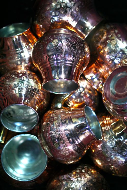 Free Intricate copper jugs showcasing traditional handicraft techniques in Gaziantep, Turkey. Stock Photo