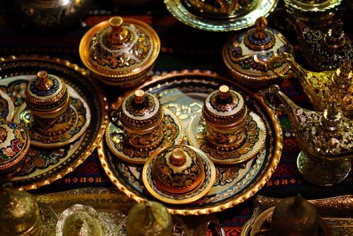 Free Explore traditional Turkish coffee sets with intricate designs in a Gaziantep bazaar. Stock Photo