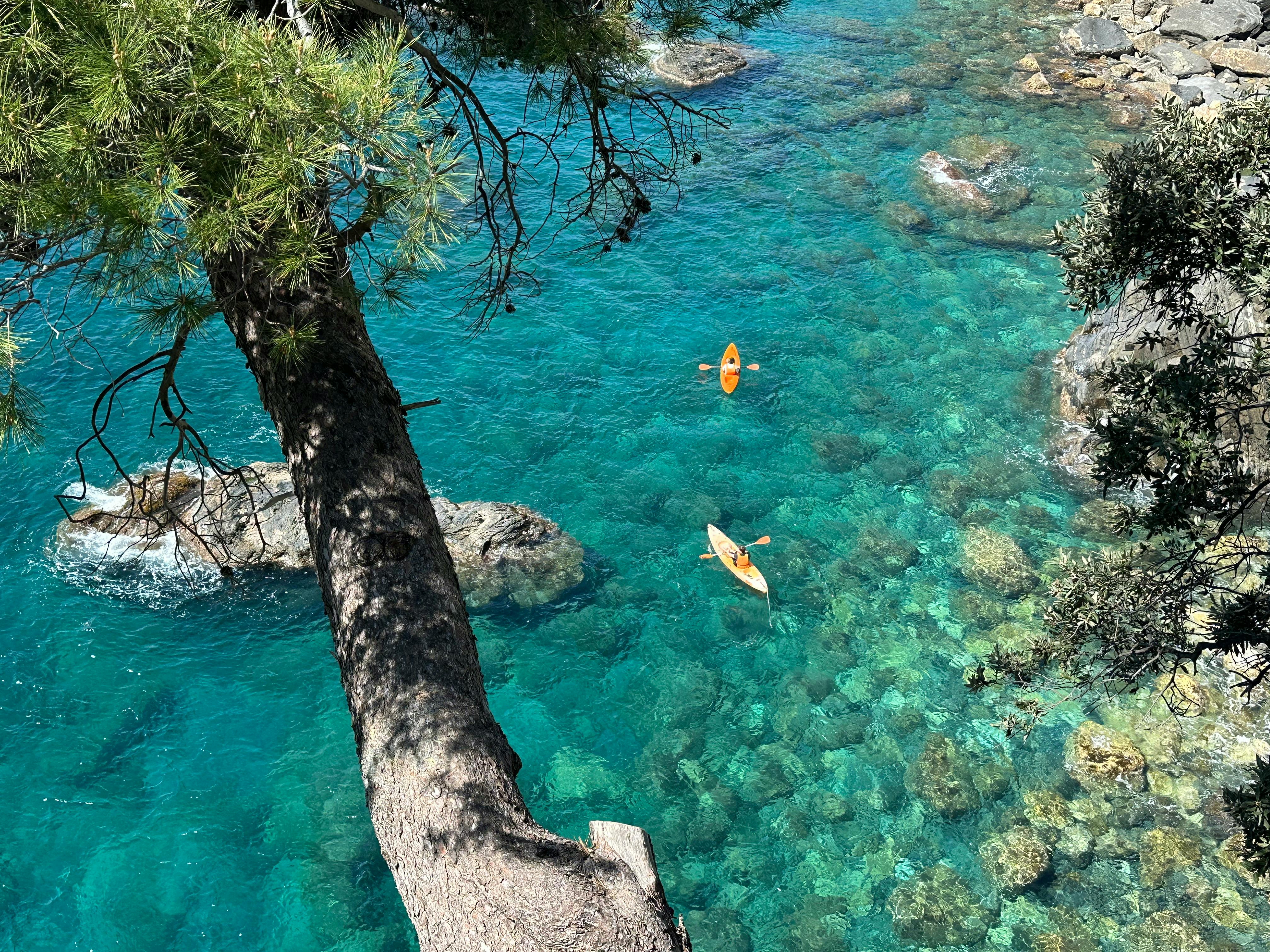 Aerial view of kayakers in turquoise waters near Athens