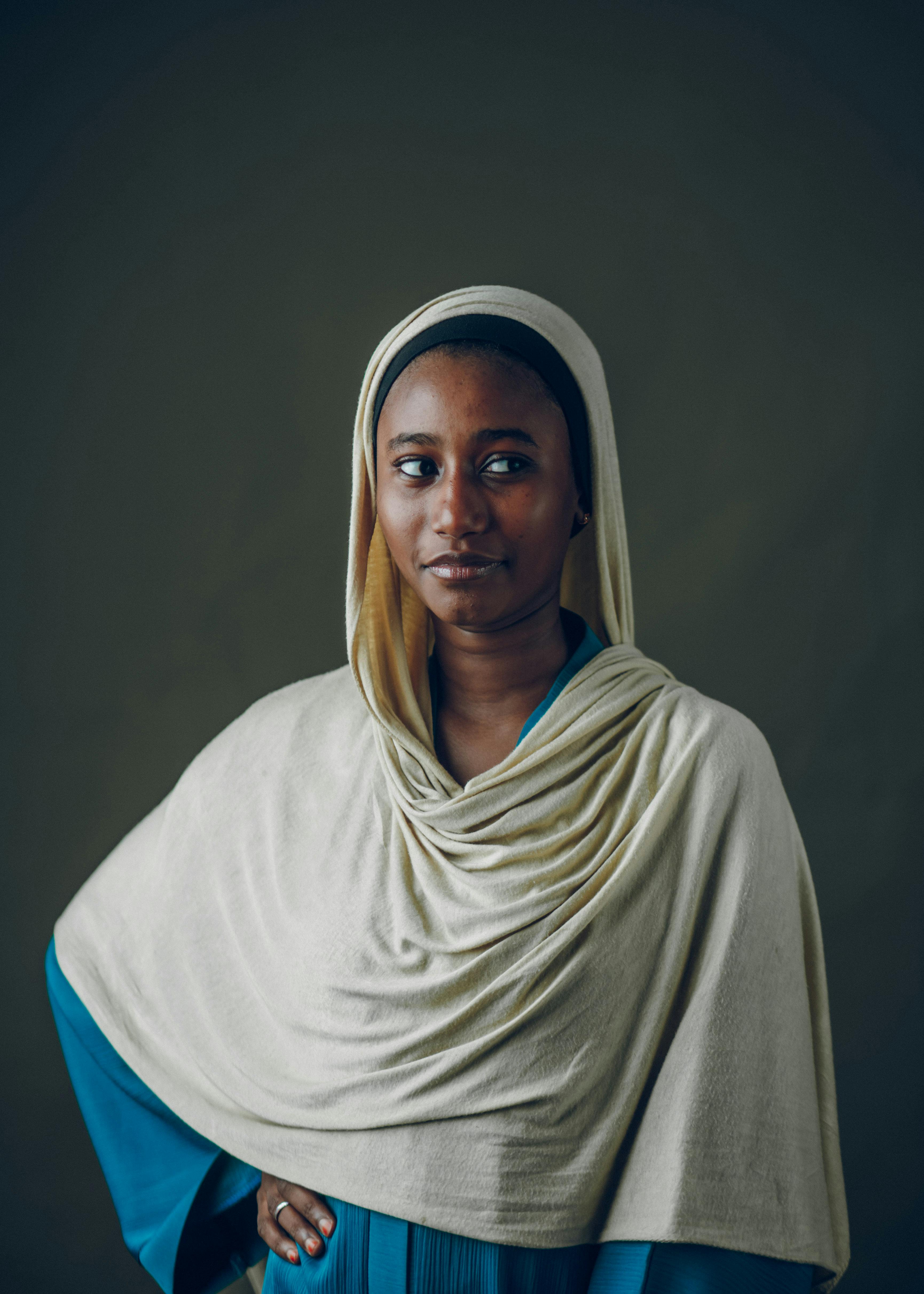 Elegant portrait of a woman wearing traditional Hausa clothing with a serene expression.