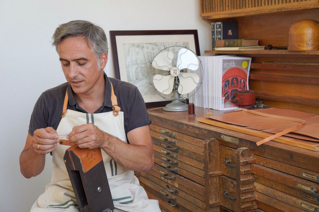 A leather artisan at work in the TrachtHouse atelier