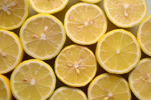 Free Close-up of vibrant lemon halves showcasing their juicy pulp and refreshing texture. Stock Photo