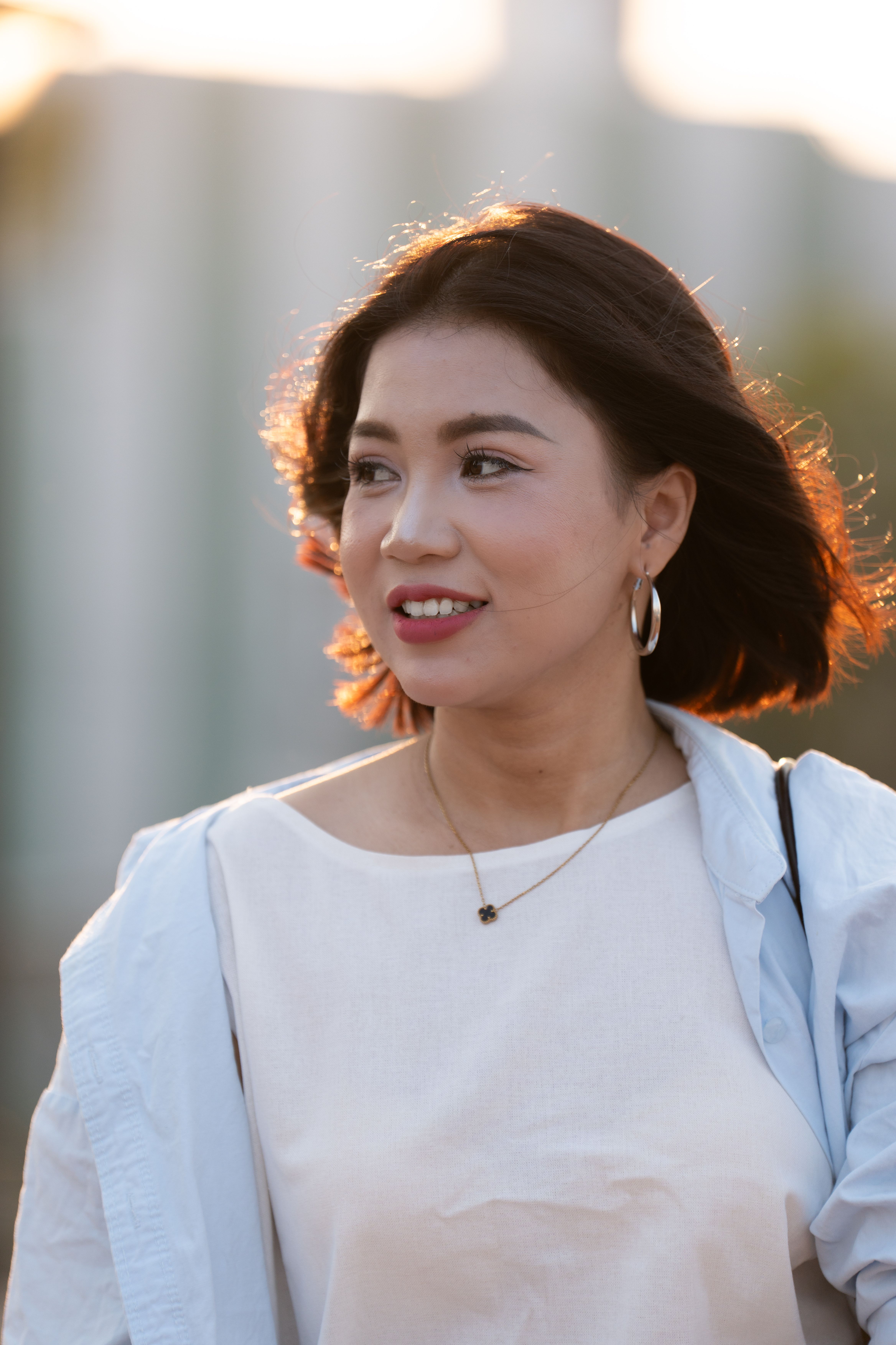 Portrait of a Smiling Woman Outdoors · Free Stock Photo