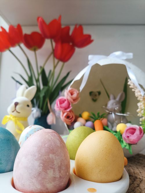 Free Vibrant Easter eggs with tulips and bunny decorations, perfect for spring celebrations. Stock Photo