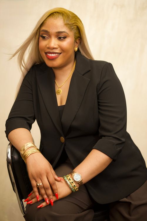 Free Elegant woman in black blazer smiling confidently indoors, showcasing fashion elegance. Stock Photo
