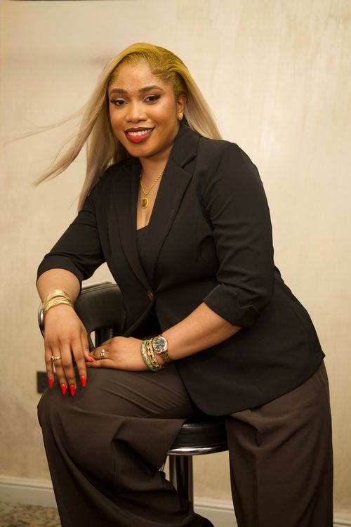Free Elegant woman in a black blazer poses confidently indoors, exuding professionalism. Stock Photo
