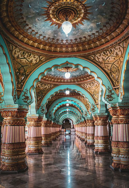 Free Stunning corridor with ornate columns and arches inside a historic Indian palace. Stock Photo