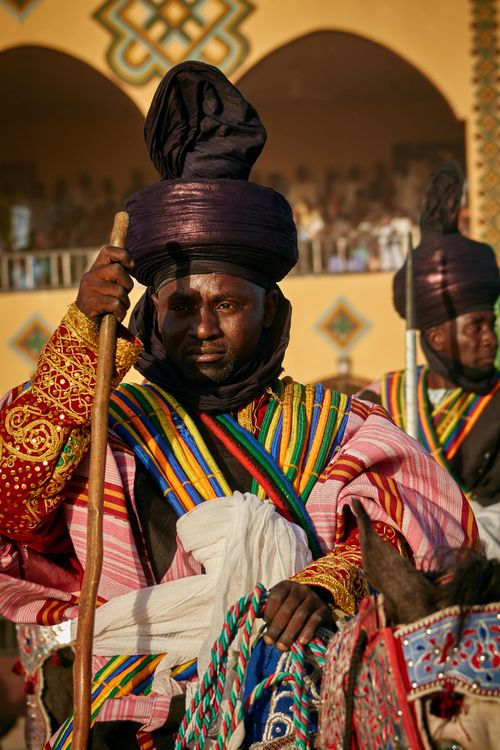 Free Horse riders in vibrant traditional attire at a Nigerian festival, showcasing rich cultural heritage. Stock Photo