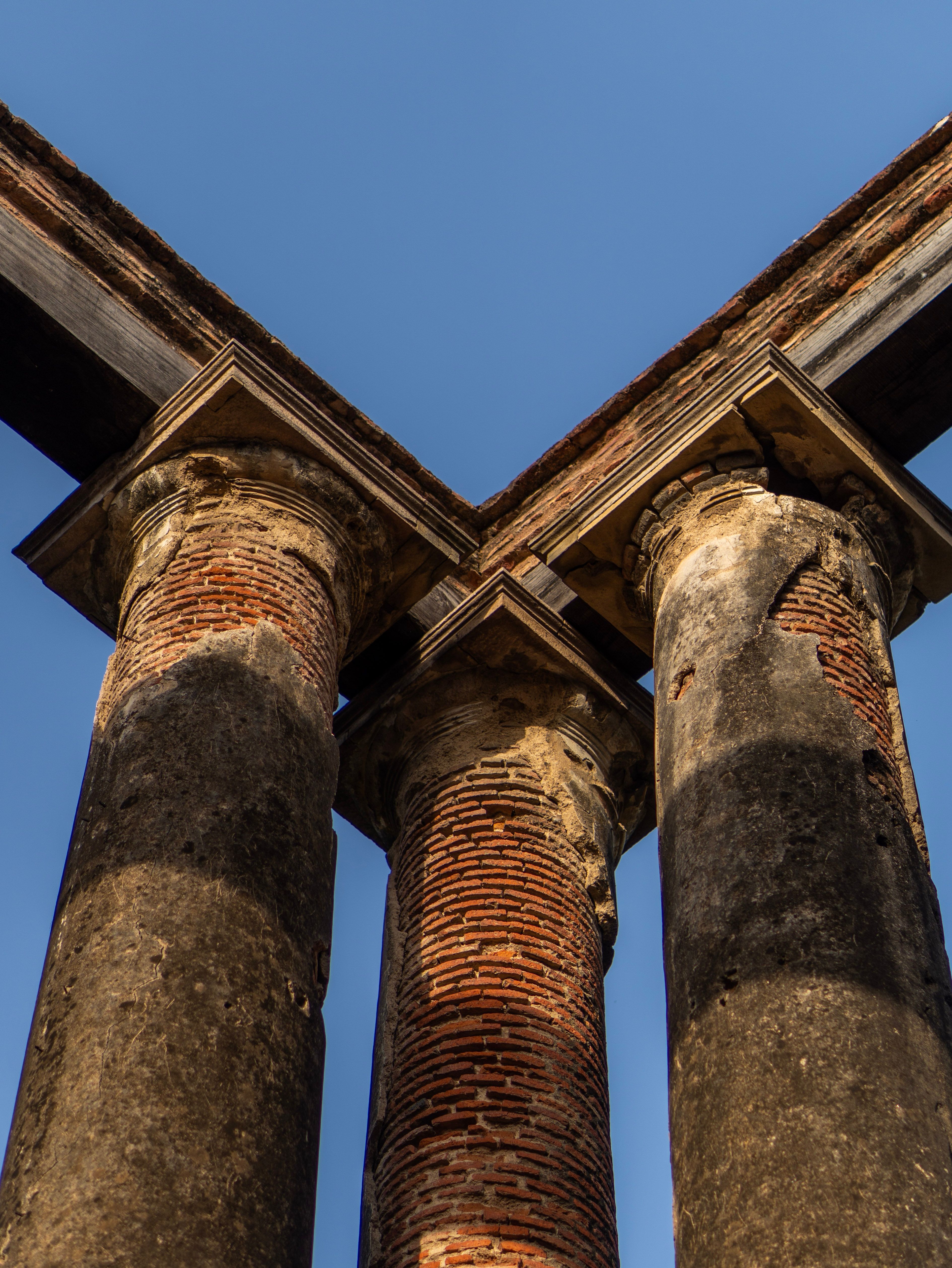 Ancient Architectural Stone Columns under Blue Sky · Free Stock Photo