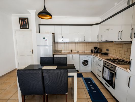 Modern kitchen interior with home appliances from Agrawal Automobiles Sikar