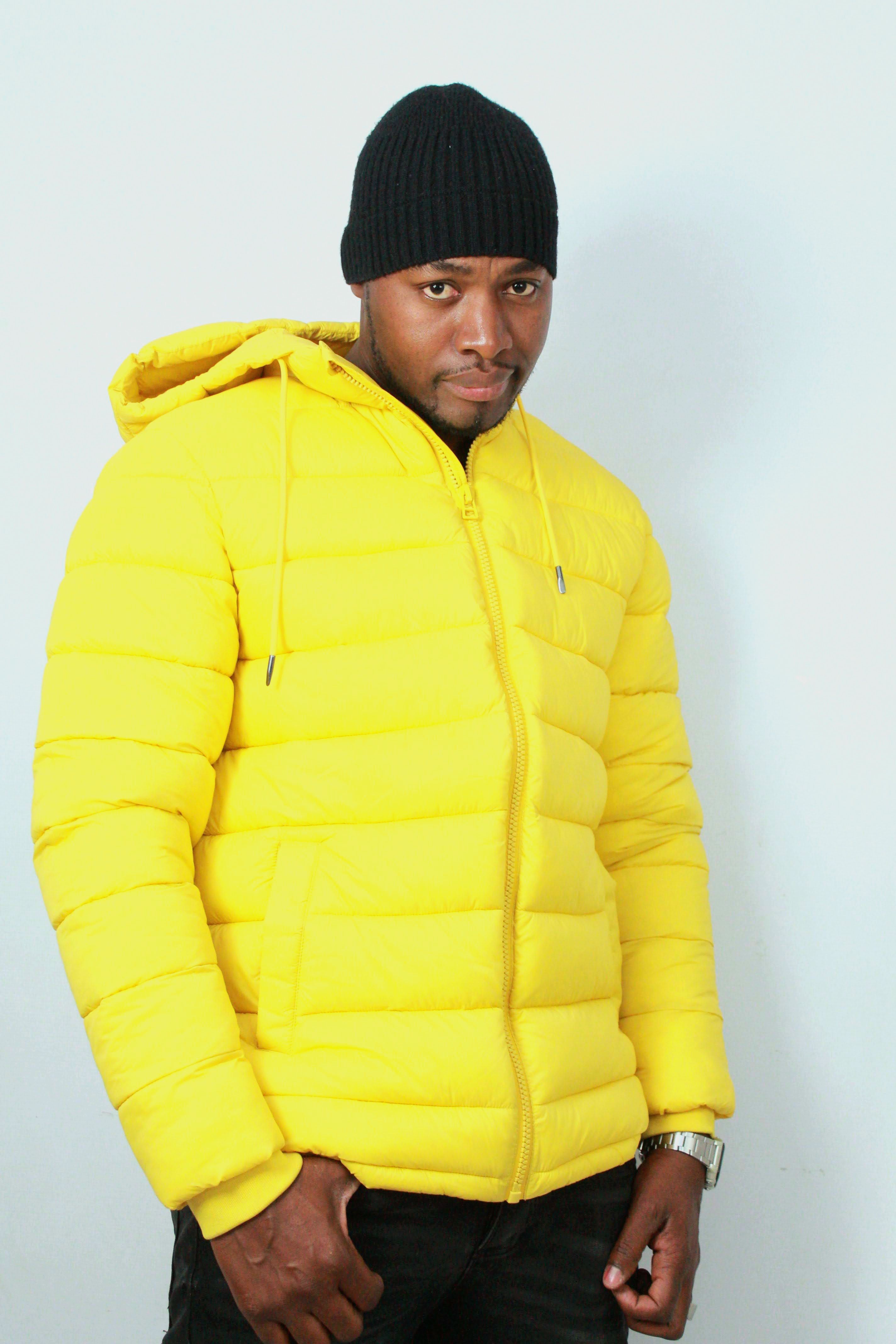 Portrait of a Man in Yellow Jacket, Black Beanie · Free Stock Photo