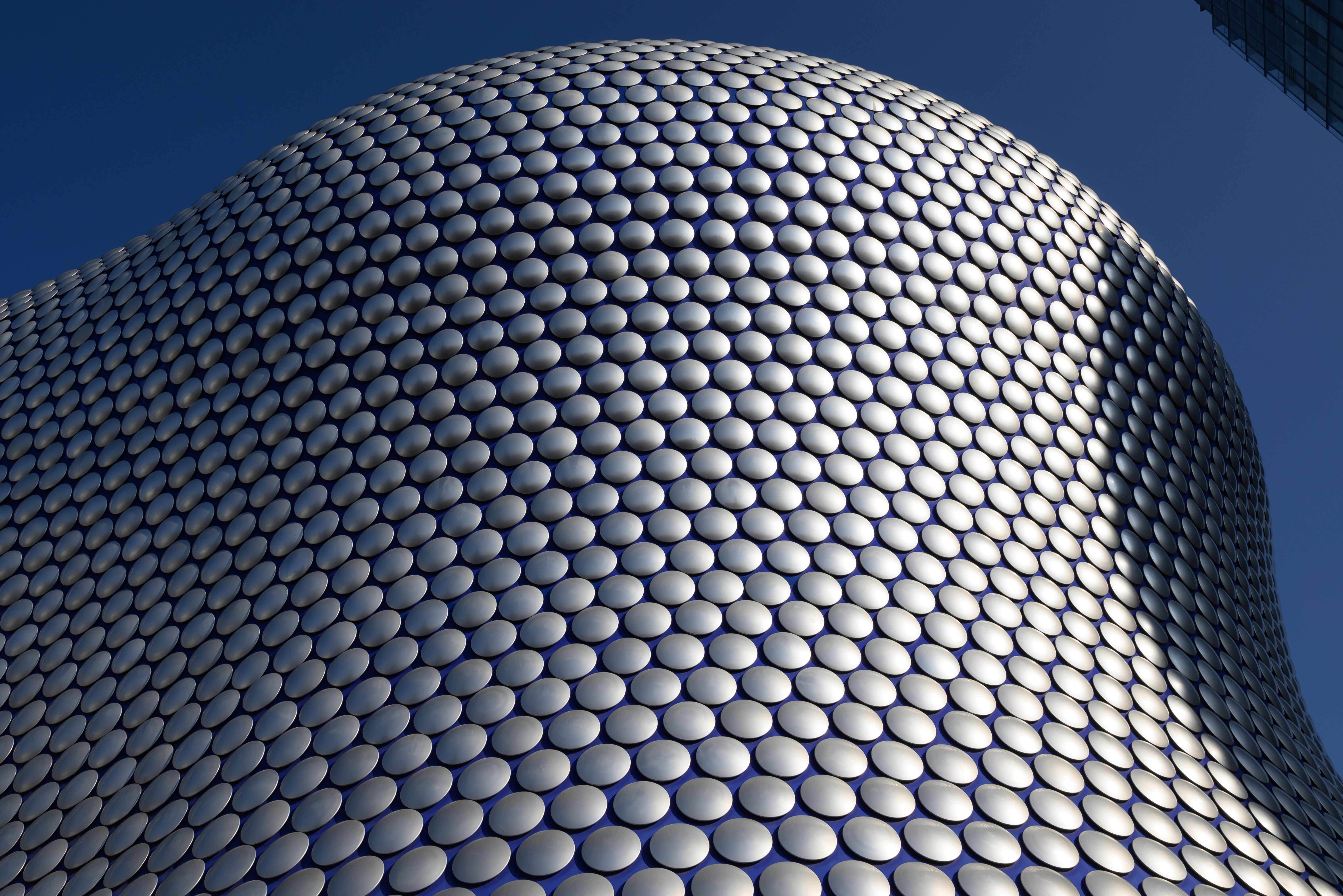 Close-up of the futuristic design and curved facade of the Selfridges Building, Birmingham, England.