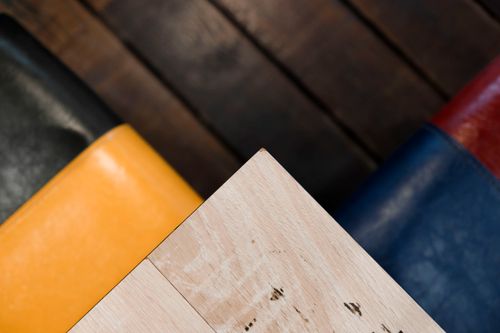 Free Close-up of a light wood table corner with colorful chairs in Taipei City, Taiwan. Stock Photo