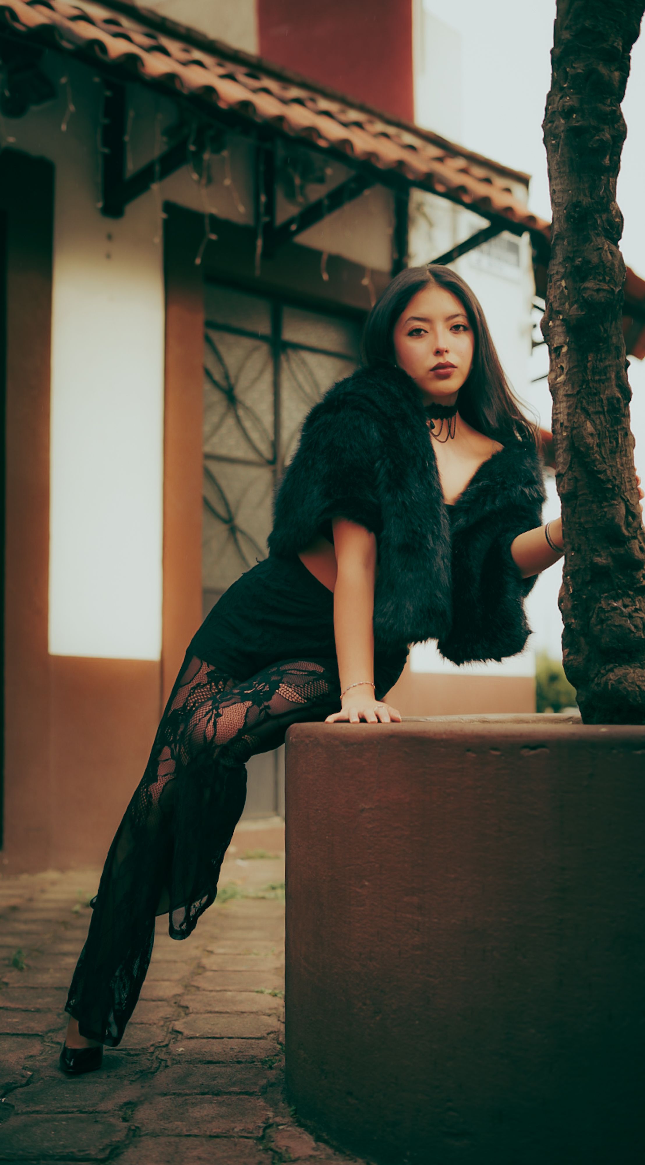 Elegant Woman Posing Outdoors in Stylish Attire · Free Stock Photo