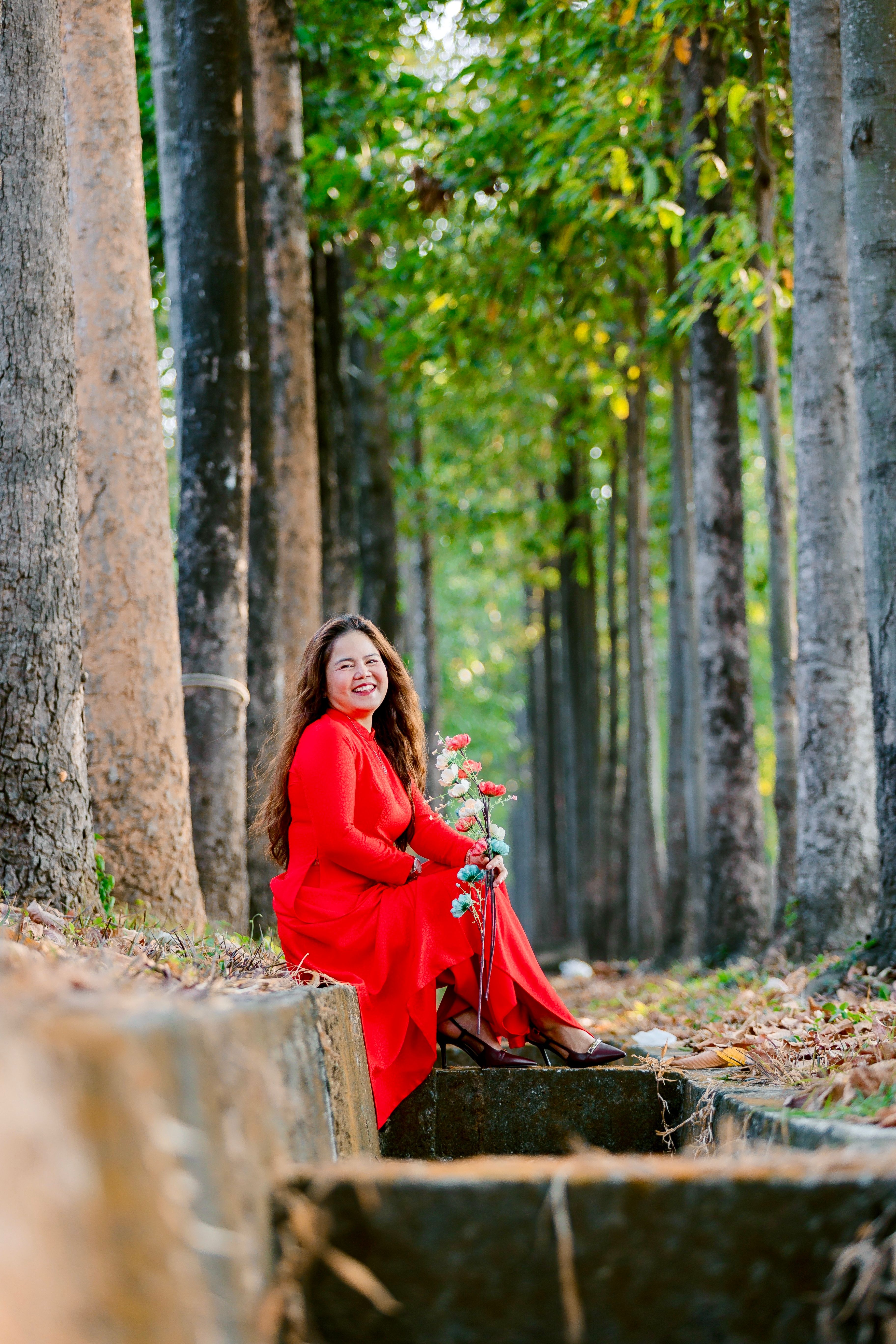 Woman in Red Dress Posing in Forest · Free Stock Photo