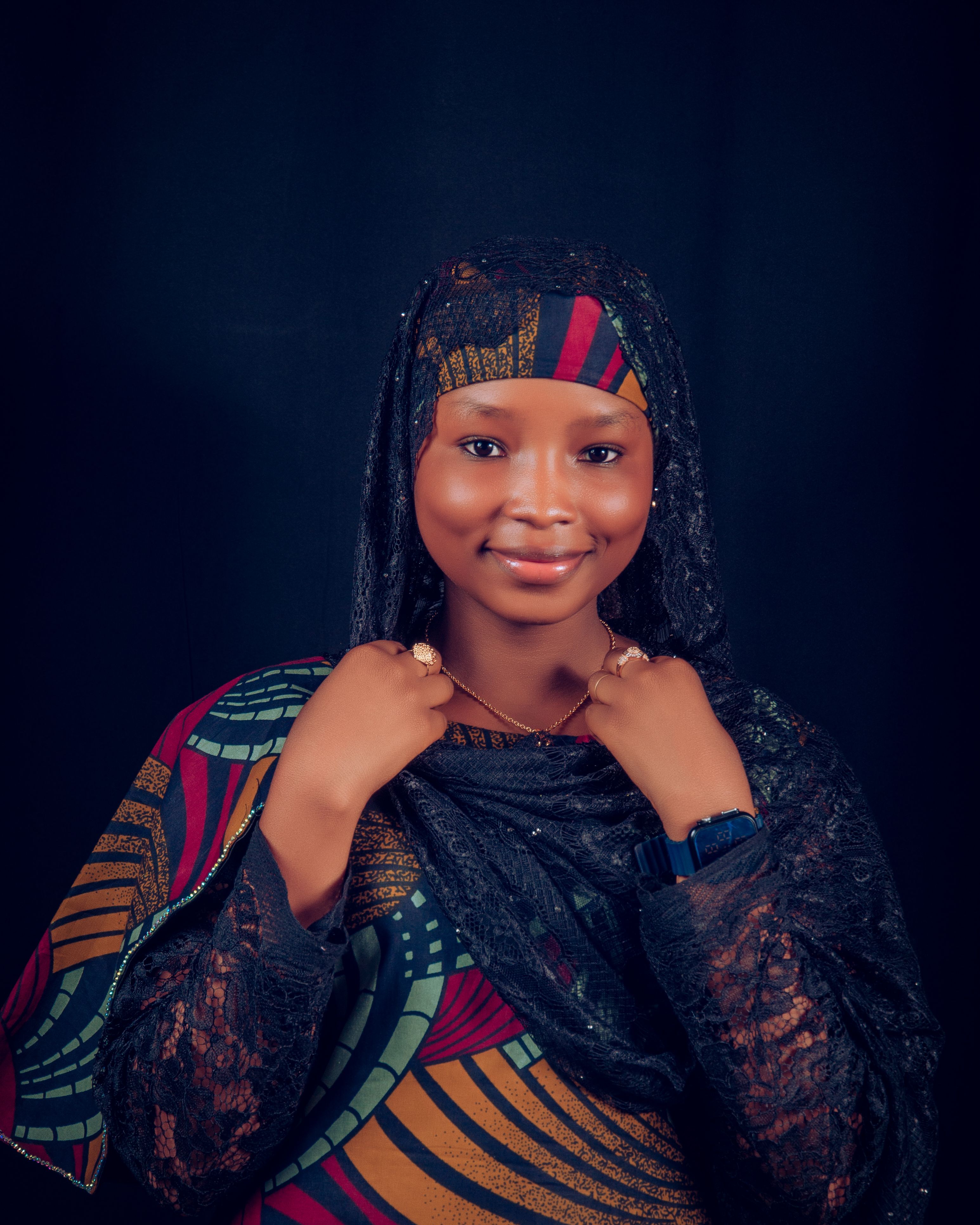 Portrait of a Smiling Woman in Traditional Attire · Free Stock Photo