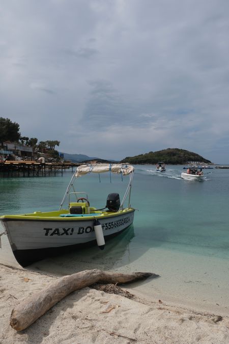Boats anchored near tropical beach in Ksamil Albania