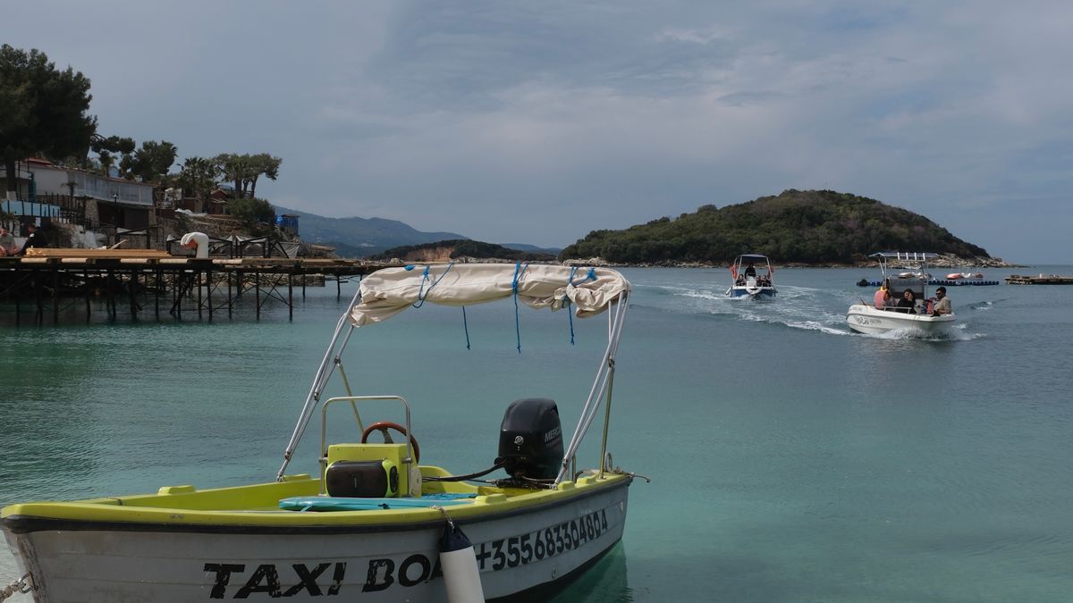 Boats anchored near tropical beach in Ksamil Albania
