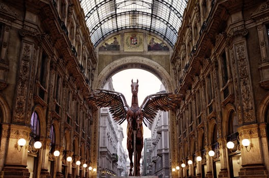 Stunning view of the Galleria Vittorio Emanuele II showcasing a Pegasus statue beneath the iconic skylight. by Pixabay