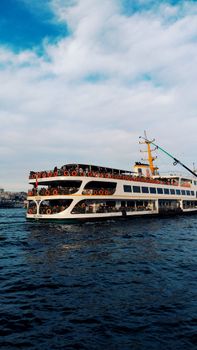 A bustling ferry navigating the Bosphorus in Istanbul, capturing the vibrant city atmosphere.
