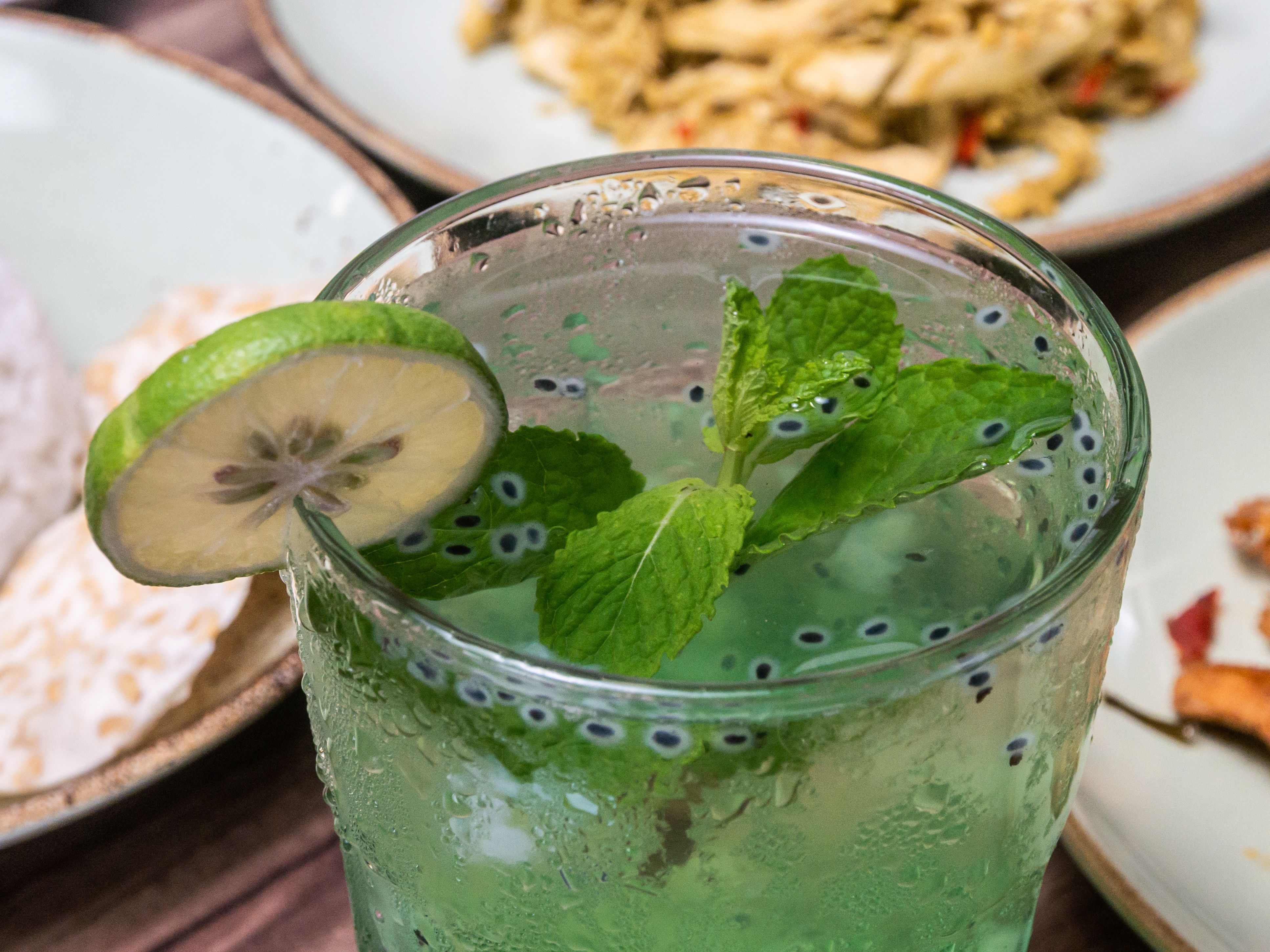 A refreshing mint lime drink with basil seeds, perfect for summer enjoyment.