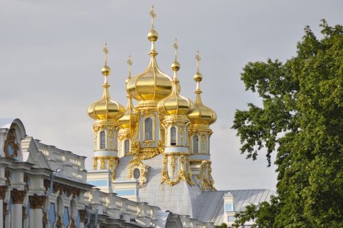Free Stunning golden domes of Catherine Palace in Saint Petersburg, Russia, shining under a clear sky. Stock Photo
